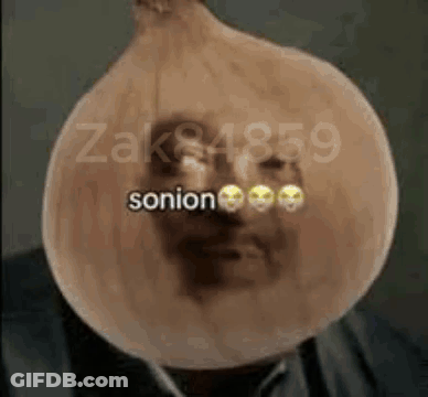 Man In Suit Covered In Onion With Smiley Face GIF