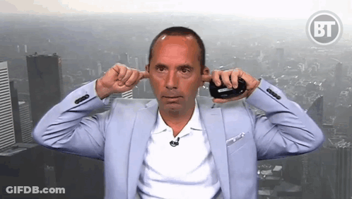 Man In Suit Covering Ears In Front Of BF Logo GIF