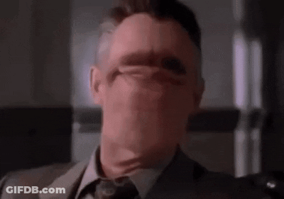 Man In Suit Covering Face GIF