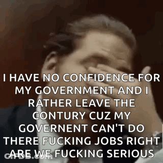 Man In Suit Covering Face And Making Funny Face GIF