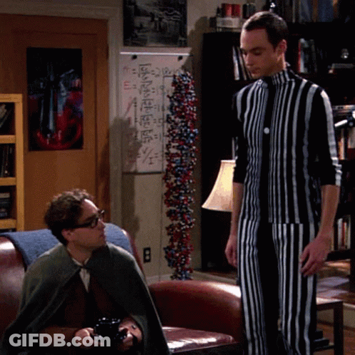Man In Suit Covering Face, Another Looking On GIF