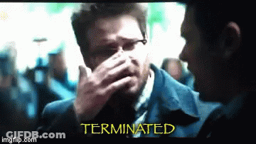 Man In Suit Covering Face Terminated GIF