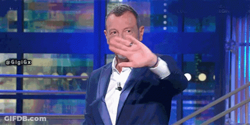 Man In Suit Covering Face With Hands GIF