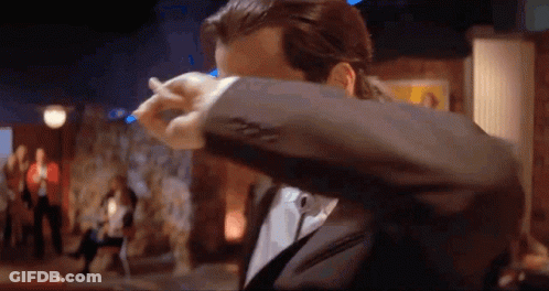 Man In Suit Covering Face With Jacket GIF