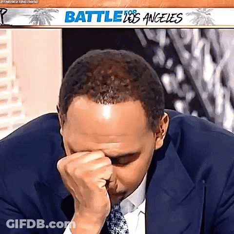 Man In Suit Covering Face GIF
