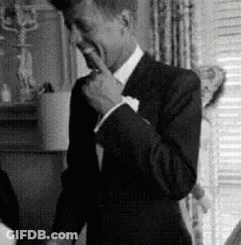 Man In Suit Covering Mouth GIF