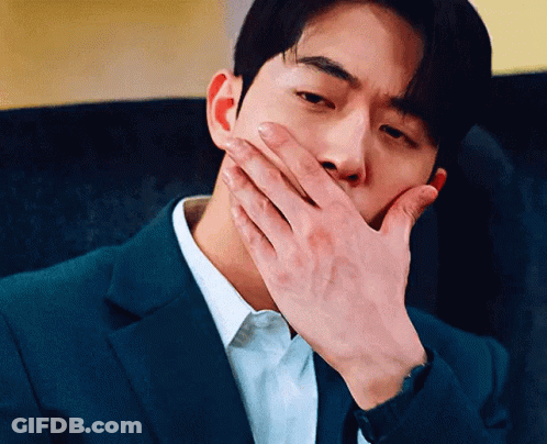 Man In Suit Covering Mouth GIF