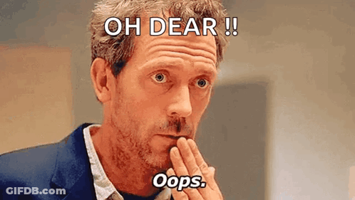 Man In Suit Covering Mouth Making Funny Face GIF