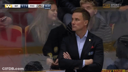 Man In Suit Covering Mouth Watching Sports GIF