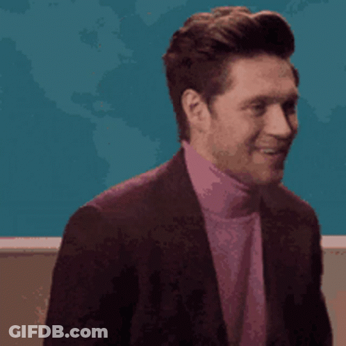 Man In Suit Covering Nose With Hand GIF