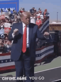 Man In Suit Dancing At Rally GIF