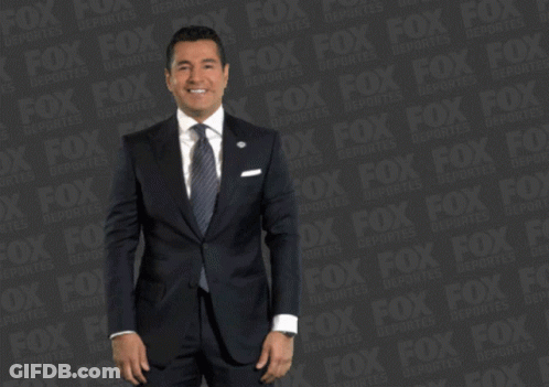 Man In Suit Dancing By Fox Logo GIF