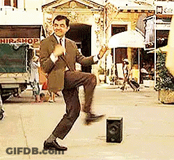 Man In Suit Dancing By Speaker On Street GIF