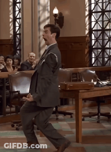 Man In Suit Dancing In Courtroom GIF