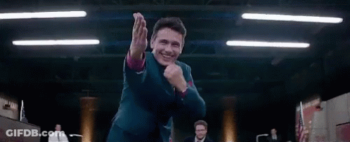 Man In Suit Dancing In Dark Room GIF