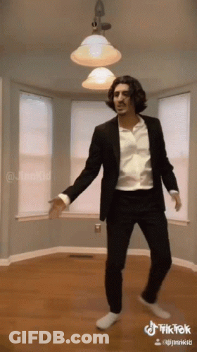 Man In Suit Dancing In Empty Room TikTok GIF