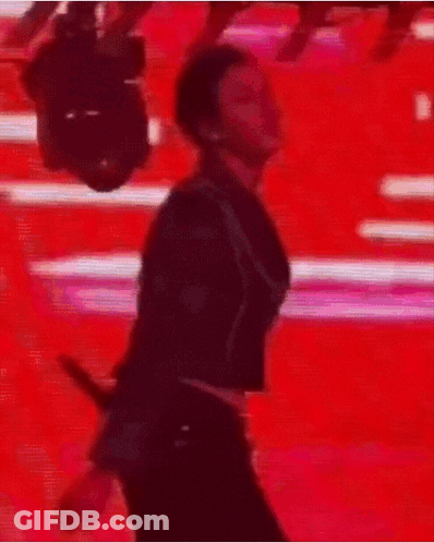 Man In Suit Dancing In Front Of Camera GIF