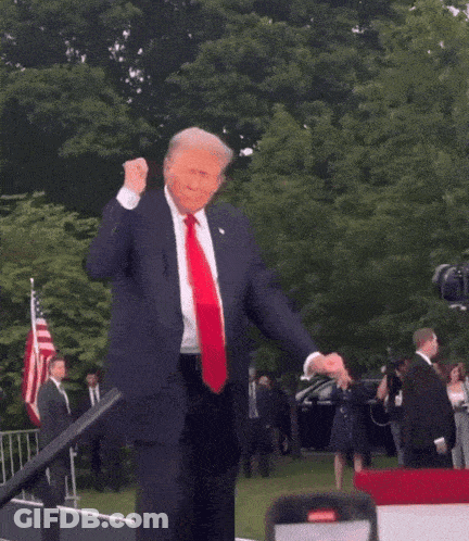 Man In Suit Dancing In Front Of Crowd GIF