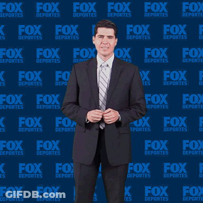Man In Suit Dancing In Front Of Fox Deportes Wall GIF