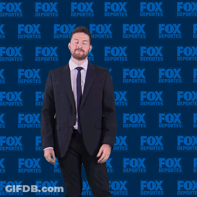 Man In Suit Dancing In Front Of Fox Deportes Wall GIF