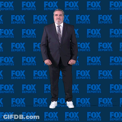 Man In Suit Dancing In Front Of Fox Deportes Wall GIF
