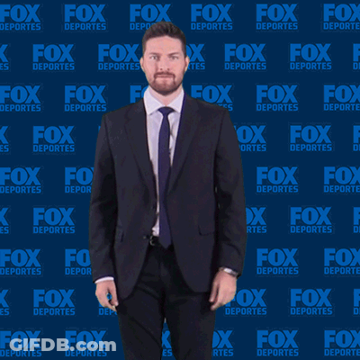 Man In Suit Dancing In Front Of Fox Deportes Wall GIF