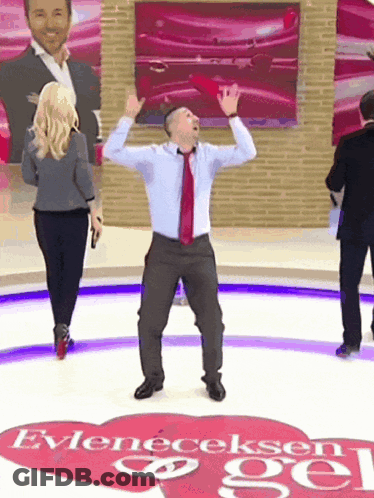 Man In Suit Dancing In Front Of Heart Saying Evleneceksen Gel GIF