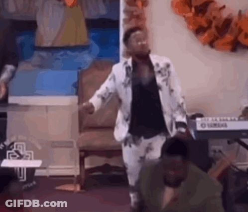 Man In Suit Dancing In Front Of Keyboard GIF