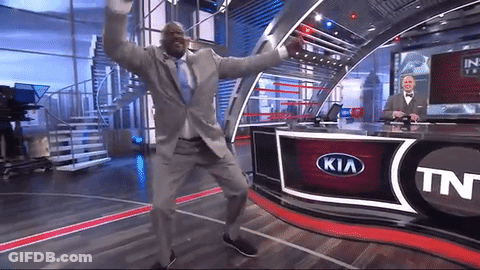 Man In Suit Dancing In Front Of Kia Logo GIF