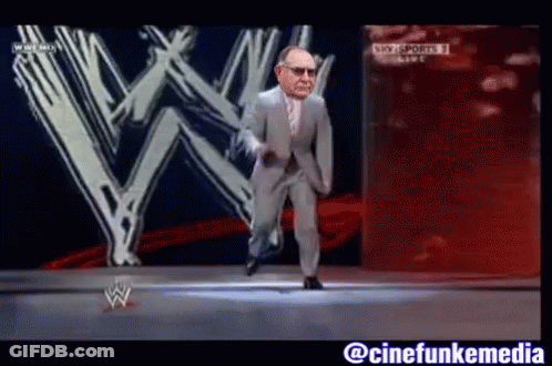 Man In Suit Dancing In Front Of W Logo GIF