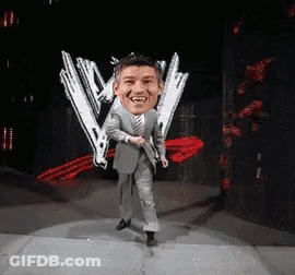 Man In Suit Dancing In Front Of W Logo GIF