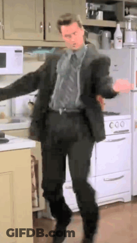 Man In Suit Dancing In Kitchen GIF