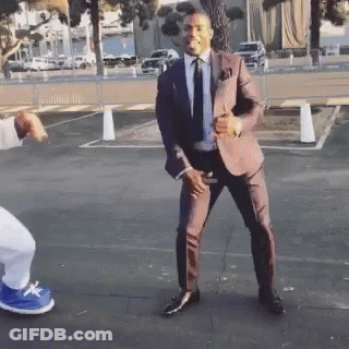 Man In Suit Dancing In Parking Lot GIF