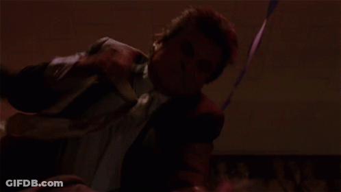 Man In Suit Dancing In Red Room GIF