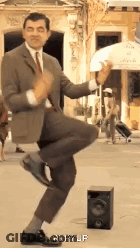 Man In Suit Dancing In Street GIF