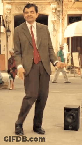 Man In Suit Dancing In Street GIF