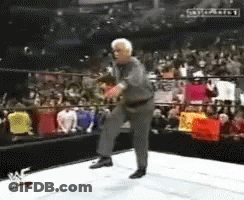 Man In Suit Dancing In Wrestling Ring GIF