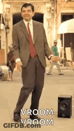 Man In Suit Dancing Next To Speaker GIF