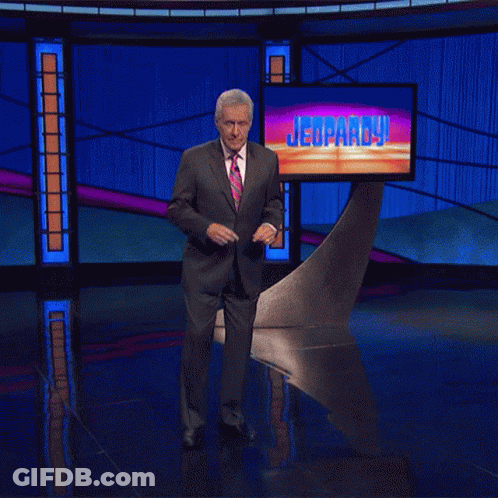 Man In Suit Dancing On Jeopardy Stage GIF