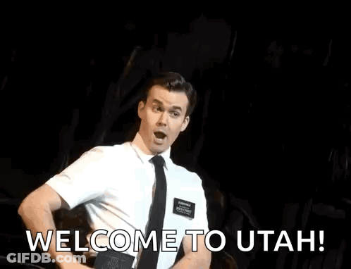 Man In Suit Dancing On Stage Saying Welcome To Utah GIF