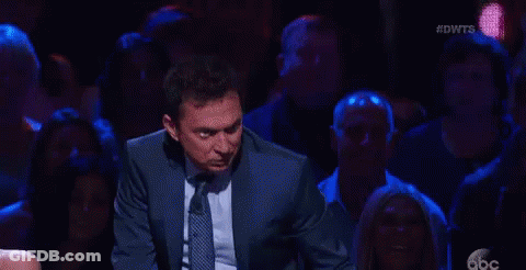 Man In Suit Dancing On Stage GIF