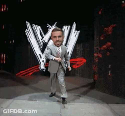 Man In Suit Dancing On Stage With W Logo GIF