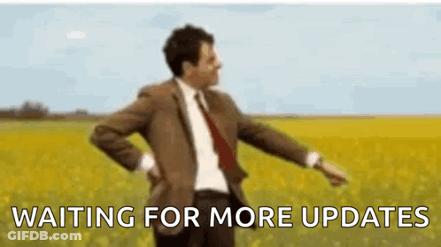 Man In Suit Dancing Waiting For More Updates GIF