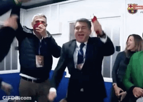 Man In Suit Dancing With Group GIF