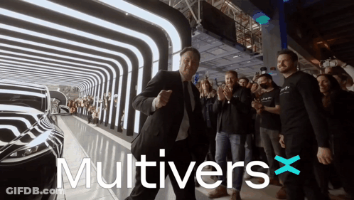 Man In Suit Dancing With Multivers X Behind Him GIF