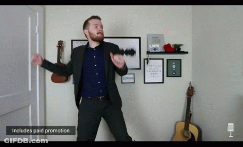 Man In Suit Dancing With Paid Promotion Sign GIF