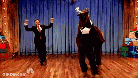 Man In Suit Dancing With Reindeer GIF