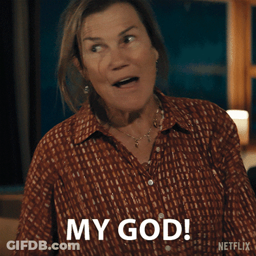 Man In Suit Dancing With Woman In Floral Pants GIF