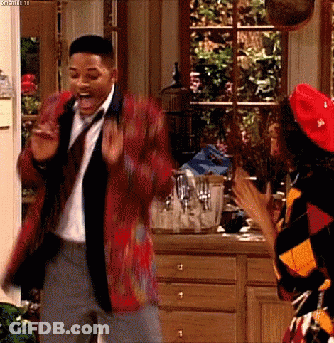 Man In Suit Dancing With Woman In Red Hat GIF