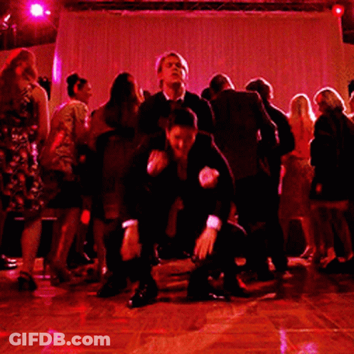 Man In Suit Doing Handstand On Another Man's Back GIF